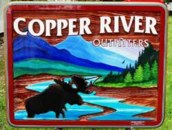 Copper River Outfitters,Smithers BC,Lanscape painting of mountains and moose on a custom made sandblasted cedar sign,busines sign of all kinds.Condor signs Vernon Bc