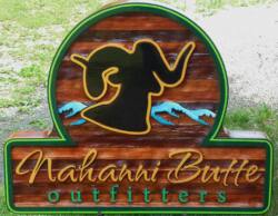 Nahanni Butte outfitters, sandblasted ceadar sign,Business signs,mountain sheep logo sand blasted into cedar for a custom sign,we ship anywhere,Condor signs Vernon BC