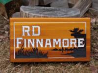 reverse sanblased cedar sign for house.