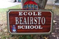 Sandblasted cedar signs for schools first nations, police, service clubs manufactured by condor systems Vernon BC