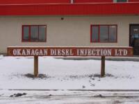 sand caeved /blasted log sign for okanogan diesel injection ltd. Vernon Bc