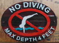 Custom made sandblasted artist painted wayfinding sign by Condor Signs Vernon BC