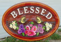 sandblasted cedar sign "Blessed" custom made,handcrafted and artist painted by Condor Systems Veron BC
