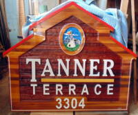 Sandblasted cedar sign for Vernon Native Housing Tanner Terrace artist painted ,handcrafted by Condor Signs Vernon BC