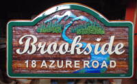 Sandblasted cedar sign Custom designed and constructed for Brookside development in Whitehorse NWT Canada.Condor Signs/systems ships signs anywhere.