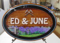 wooden house sign foe Ed&June custom made and artist painted sandblasted cedar sign by Condor signs Vernon BC