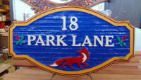 PEI wooden sign sandblasted and artist painted by Vernon sign maker Condor Signs