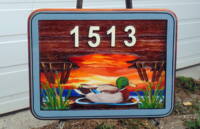 Sandblasted cedar sign with a mallard duck for SasK.by Condor signs Vernoon bc