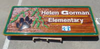 This sandblasted cedar sign is one many large pieces we have made over the years.Condor Signs has been working with large companies schools towns and institutions for decades.