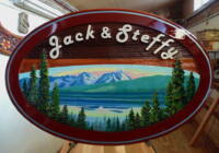 Smithers BC wood sign in sandblasted cedar.This ia a custom made artist painted sign by Condor systems Vernon BC