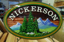 Family sign for Kamloops BC.Artist painted custom made and sandblasted in cedar By Condor signs Vernon BC