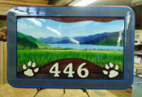 Steppingstones area of Veron BC address sign that was artist painted and.Sandblasted ceadar and wood signs custom made at Condor Signs.