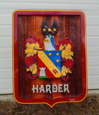 Harder coat of arms snadblasted and artist painted by Condor Signs Vernon BC.Wood signs In cedar