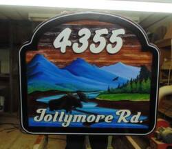 Cedar signs that are custom made,artist painted and sandblasted by Condor Signs Vernon BC