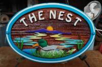 Handcrafted cedar sign for a golf course concession.Custom designed artist painted and sandblasted cedar by Condor signs Vernon BC