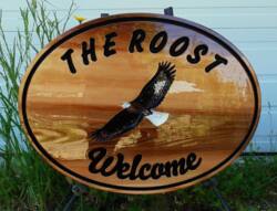 Carved cedar sign V routed and hand painted custom designed for display in Smithers BC.Manufactured by Condor Signs Vernon BC.