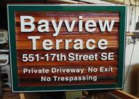 Development sign for Bayview Terrace Salmon Arm BC custom made from cedar,sandblasted and hand painted by Condor Signs