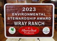 Alberta Beef Producers 2023 Environmental Award.Hand painted cedar sandblasted sign by Condor Signs Vernon BC Canada.
