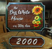 Residential sandblasted cedar sign with matching address hanger board by Condor Signs Vernon BC.